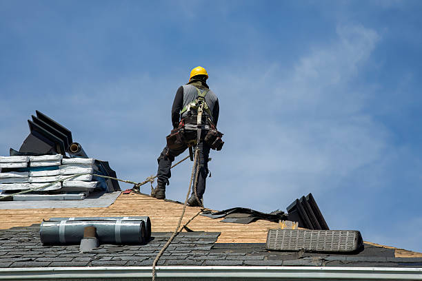 Professional Roof Replacement technician working in Manilla, IN